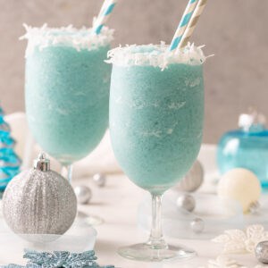 Front view of two Jack Frost mocktails with paper straws.