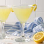 Closeup view of a lemon drop mocktail in a martini glass.