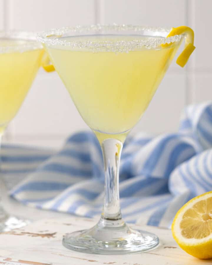Closeup view of a lemon drop mocktail in a martini glass.